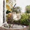 Outsunny Hanging Egg Chair Outdoor Indoor Garden Swing Chair with Folding Basket and Thickened Cushion, Garden Hanging Chair with Stand, Headrest, Cup Holder for Patio, Balcony, Khaki