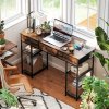 HOMCOM Computer Desk with Power Outlets, 120cm Home Office Desk with 3 Fabric Drawers and 4 Storage Shelves, Study Table Workstation for Bedroom