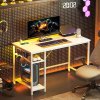 HOMCOM Computer Desk with Power Outlets, 120 x 60 cm Home Office Desk with Reversible Storage Shelves and Headphone Hook, Study Table Workstation for Bedroom, White