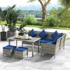 Outsunny 5 Pieces Rattan Garden Furniture Set, 6 Seater Wicker Dining Set, Corner Garden Sofa Outdoor Furniture Set with Glass Top Table, Footstool and Cushions for Patio, Dark Blue