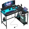 HOMCOM L Shaped Gaming Desk with LED Lights, Power Outlet, USB Charging Ports, 107cm Reversible Corner Computer Desk with Storage Shelves, Monitor Stand for Home Office, Small Space, Black
