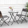 Outsunny 3 Pieces Rattan Bistro Set, Wicker Folding Garden Furniture Set with Round Glass Top Coffee Table and Chairs for Outdoor, Patio, Balcony, Brown