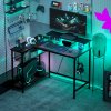 HOMCOM L Shaped Gaming Desk with LED Lights, Power Outlet, USB Charging Ports, 107cm Reversible Corner Computer Desk with Storage Shelves, Monitor Stand for Home Office, Small Space, Black