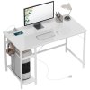 HOMCOM Computer Desk with Power Outlets, 120 x 60 cm Home Office Desk with Reversible Storage Shelves and Headphone Hook, Study Table Workstation for Bedroom, White